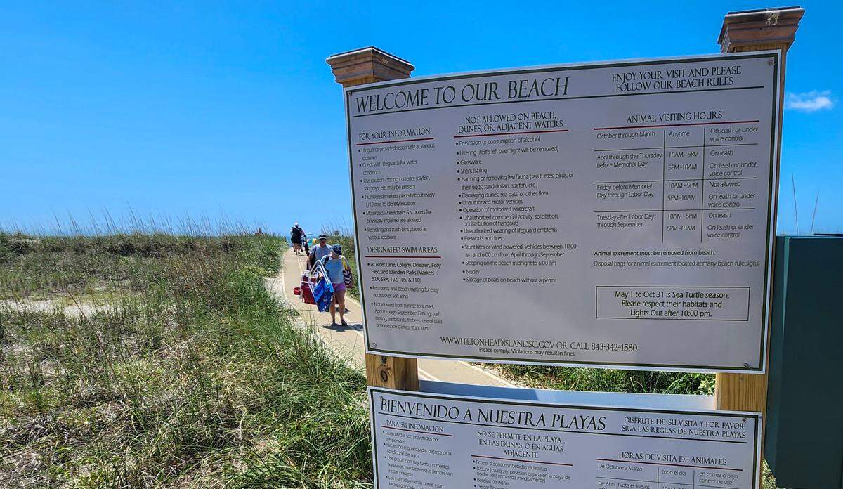 Signs in both English and Spanish greet visitors as they come onto the beaches of Hilton Head Island as seen in this photo taken on May 23, 2024 at Folly Field Beach Park. Smoking and vaping are not listed on the “not allowed on beach” list.