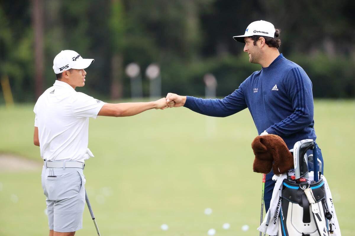 Collin Morikawa greets Jon Rahm during a practice round prior to the RBC Heritage at Harbour Town Golf Links on Hilton Head Island. The PGA Tour event begins Thursday.