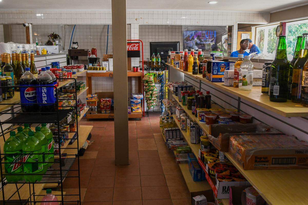 The shelves at Chaplin’s Grocery located on Storyteller Road offer a range of dry and canned foods, drinks, condiments and spices and non-food items such as charcoal as photographed on Wednesday, June 26, 2024 on St. Helena Island. This year will mark 50 years the family-owned store has been in operation.