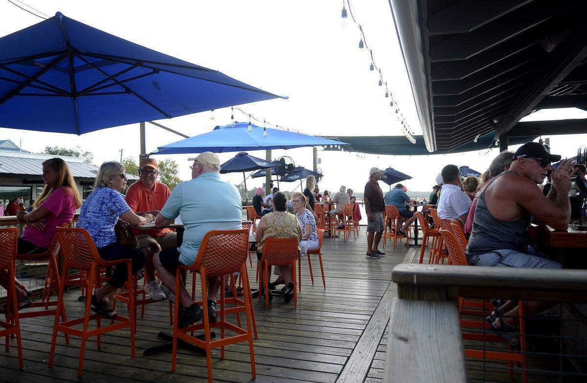 Patrons fill the deck on a Friday night at Hudson’s Seafood on the Docks on Hilton Head Island.