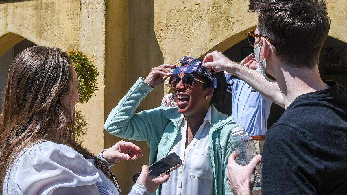 Colleagues from Beaufort’s Digital Corridor have fun during Monday’s eclipse in the courtyard of The Arsenal, home of the Beaufort History Museum. The Beaufort County Library system offered free eclipse viewing glasses at all of its branches for eclipse watch parties.