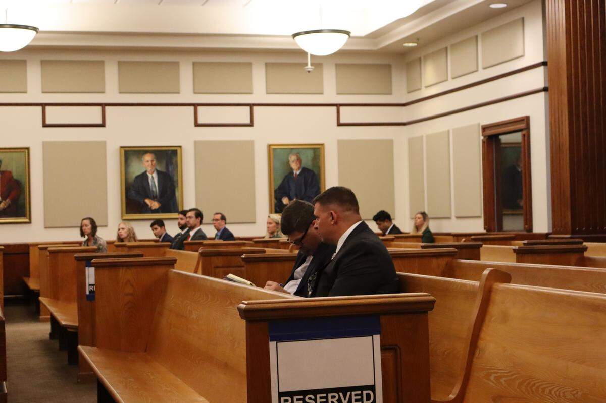 Thomas Rauchfuss (left), former quartermaster and fleet manager for the Bluffton Police Department, speaks with his attorney Richard Peacock following a bond hearing Monday afternoon at the Beaufort County Courthouse. The former civilian employee was terminated in May, several months before he was indicted on a criminal offense related to stealing firearms from the police force.