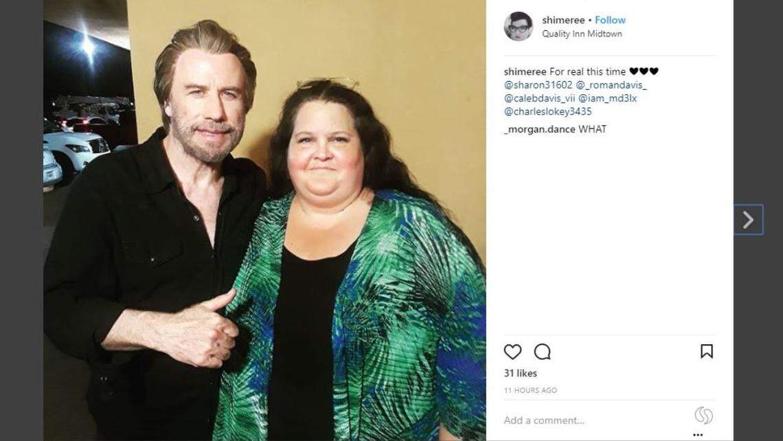 John Travola takes a photograph with a fan on Wednesday, June 20, 2018, at the Quality Inn Midtown in Savannah, Georgia, where he was filming "The Poison Rose."