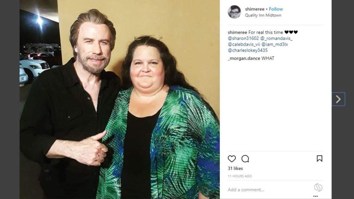 John Travola takes a photograph with a fan on Wednesday, June 20, 2018, at the Quality Inn Midtown in Savannah, Georgia, where he was filming "The Poison Rose."