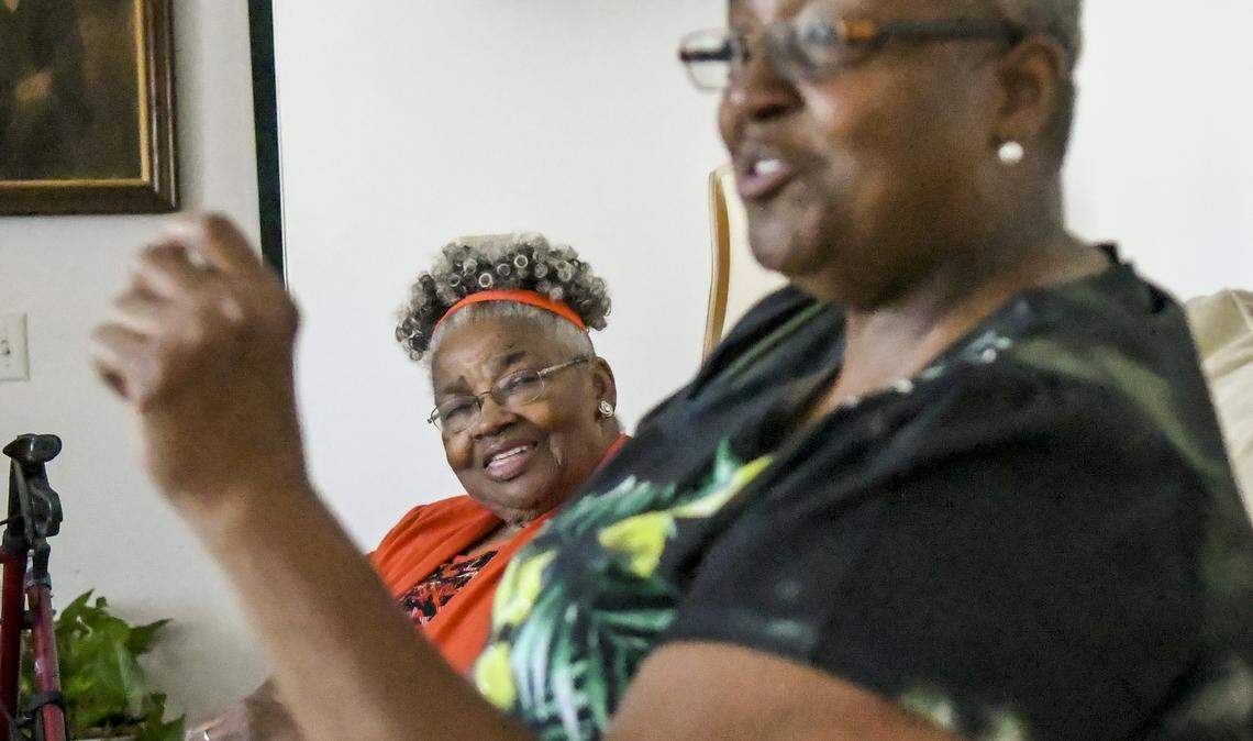 Belinda Stewart Young, 70, right, recounts counting cars traveling onto Hilton Head Island as a child on Tuesday afternoon as her mother, Margaret “Sugaree” Stewart, 92, listens as the two sit at the elder’s home along U.S. 278 located about 21 feet from the roaring traffic. Just last week, the S.C. Department of Transportation released six preliminary routes for replacing and widening the highway to the island, several of which would adversely affect the Stewart's property.