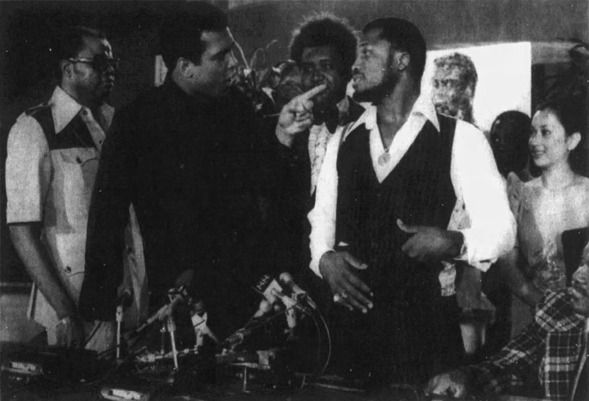 Muhammad Ali, left, points at challenger Joe Frazier on July 17, 1975. Even after his rise to fame, the Beaufort native never forgot his roots.