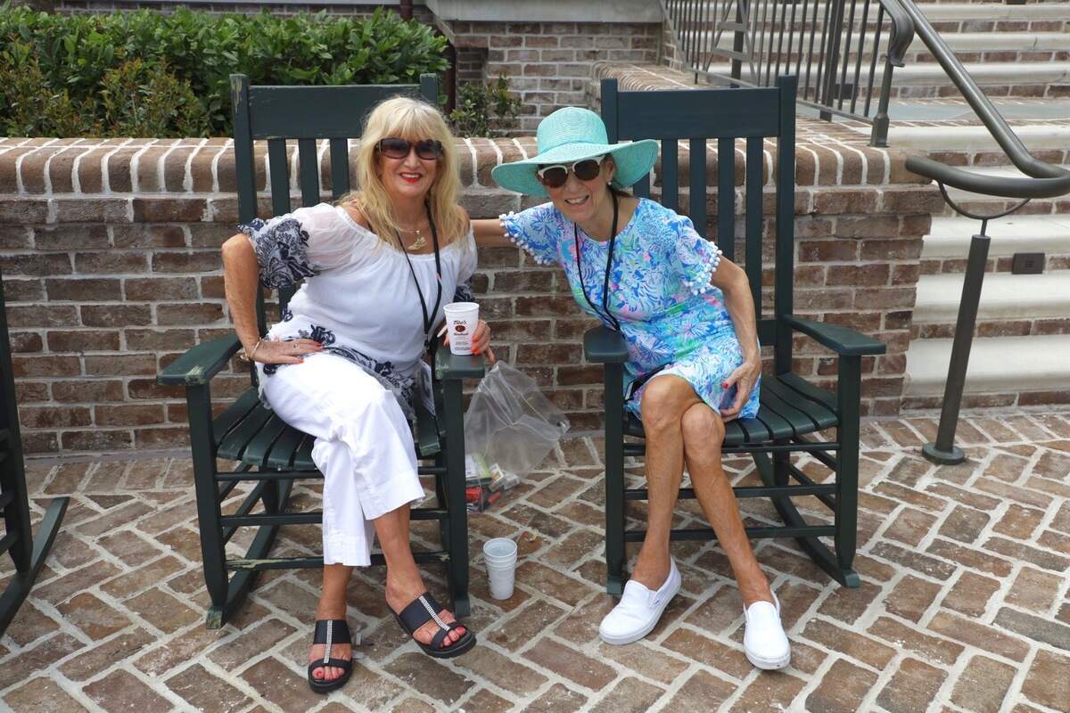 Dee Kropf, left, said she loves her top and her customized Hilton Head Island necklace. Melissa Smith, at right, loves her brightly colored hat.