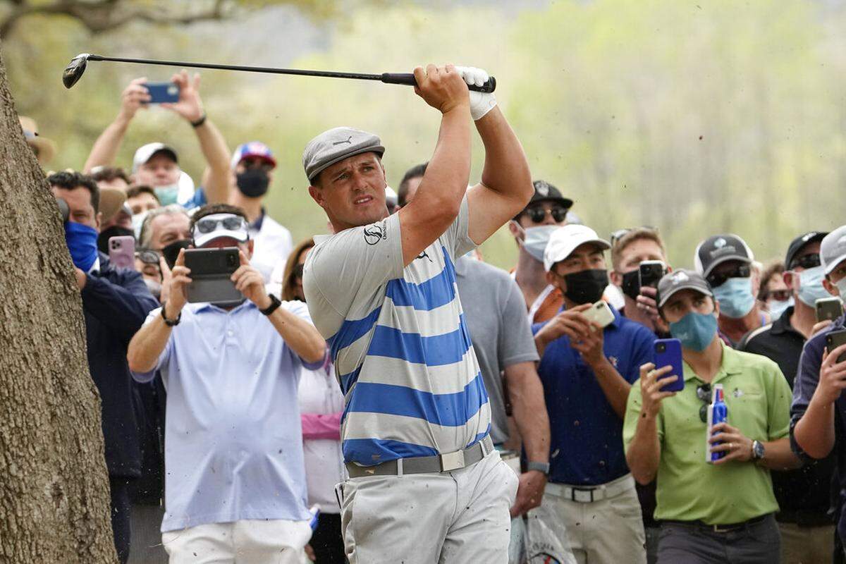 Bryson DeChambeau hits a shot near the trees on the 16th hole during a first round match at the Dell Technologies Match Play Championship golf tournament Wednesday, March 24, 2021, in Austin, Texas.