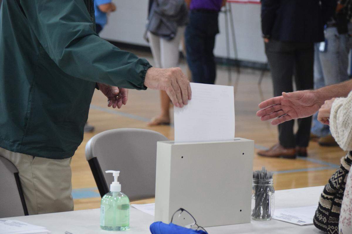 A person drops a public comment about the U.S. 278 corridor project into a box at the Island Recreation Center on Thursday, July 22, 2021.