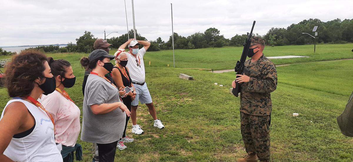 Teachers listen to a weapons instructor at Parris Island Wednesday.