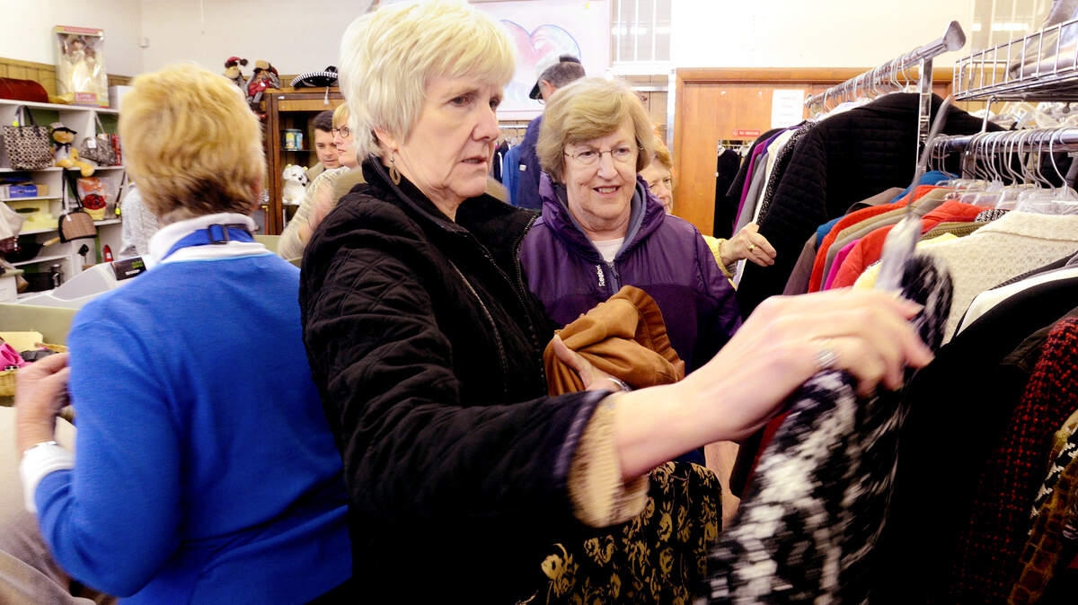 Sandy Jones, left, and Judy Goodson, on vacation from Chattanooga, Tenn., shop the racks at the Bargain Box on Wednesday. Jones said the selection was "awesome." The Hilton Head Island charity is celebrating its 50th anniversary, during which time it has raised $13.9 million.