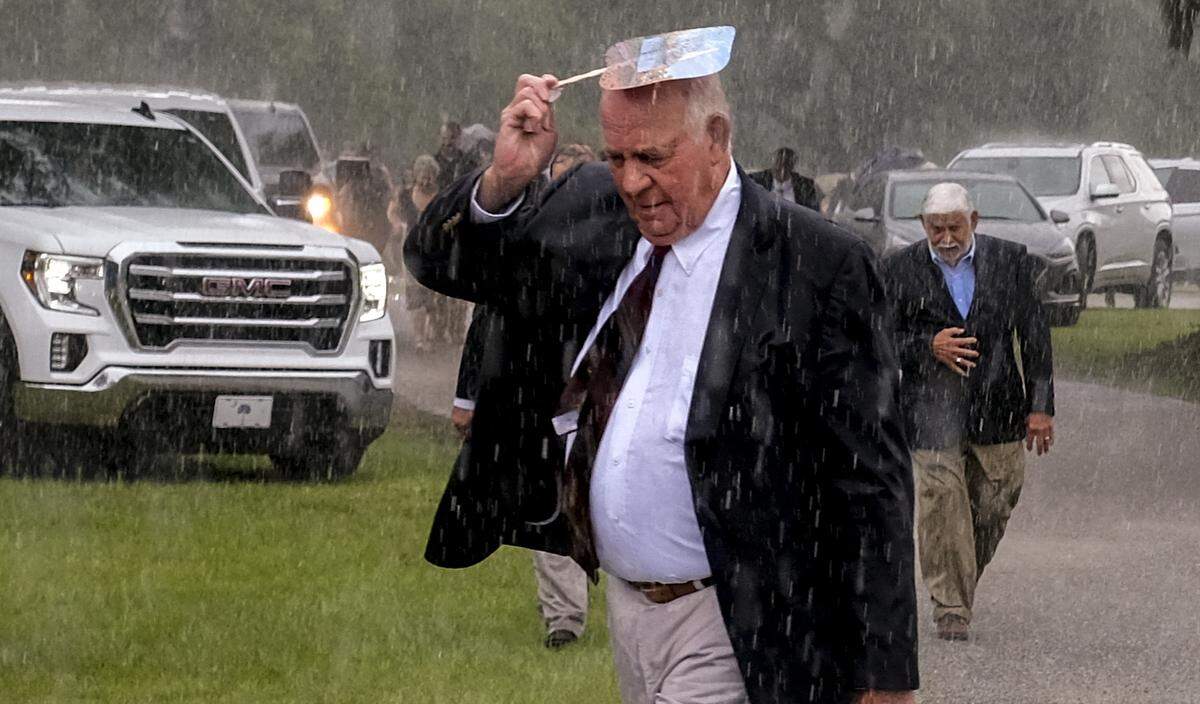 Torrential rains brought the service for Maggie Murdaugh and her son, Paul Murdaugh to an early close on Friday, June 11, 2021 at the Hampton Cemetery in Hampton. The two were murdered on June 7, 2021 outside their family’s home in Colleton County.