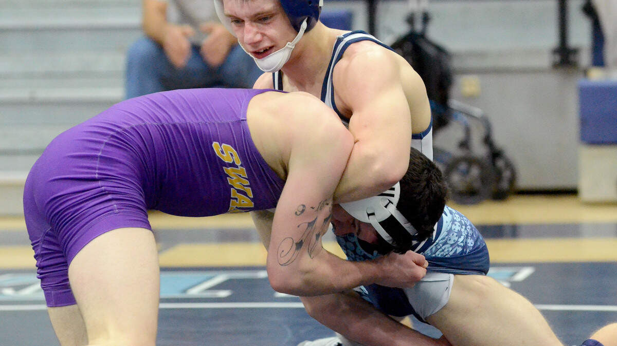 Hilton Head's James Roberts, top, defeated his Swansea opponent during their 132-pound bout of Monday's Class 3-A playoff meet.