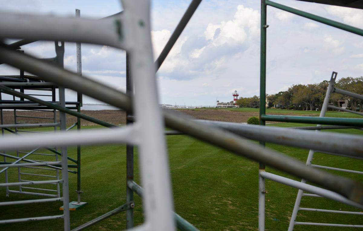 The Harbour Town Lighthouse is framed between scaffolding left in disarray for the mid-April RBC Heritage on Tuesday, March 17, 2020,  near the 18th tee of Harbour Town Golf Links in Sea Pines on Hilton Head Island.