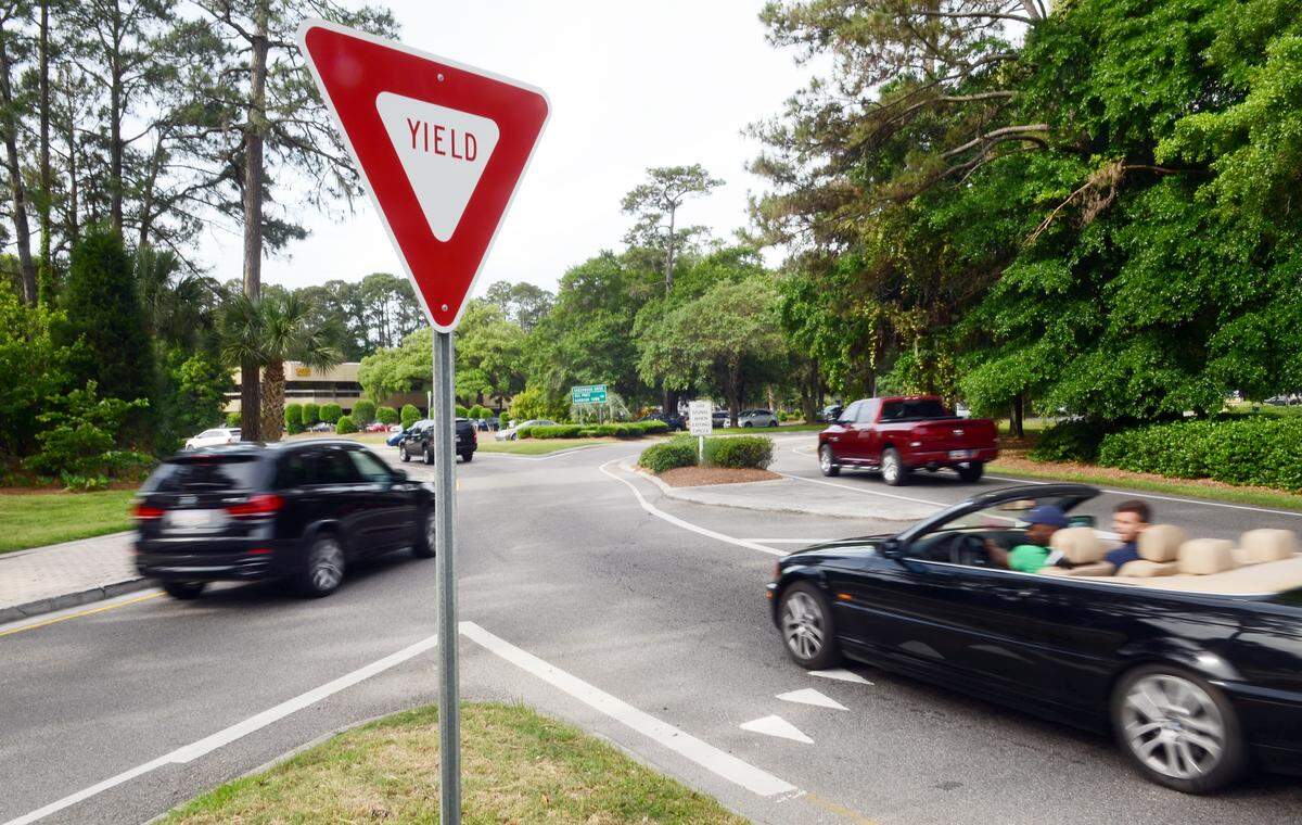 Traffic moves around Sea Pines Circle as a car prepares to enter from Palmetto Bay Road on May 10, 2015.