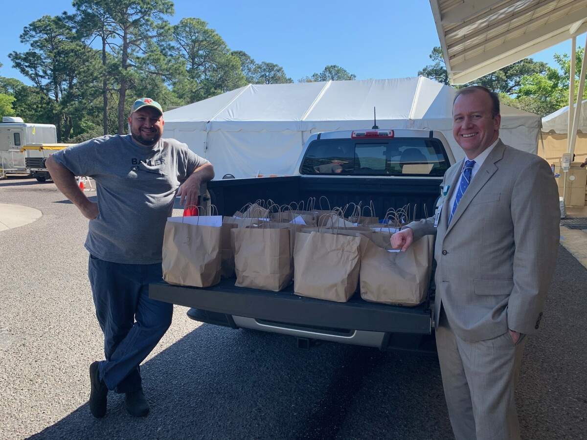 The Lucky Rooster Kitchen + Bar’s chef and owner Clayton Rollison delivers a round of meal kits to Hilton Head Hospital employees on Thursday, April 2, 2020.