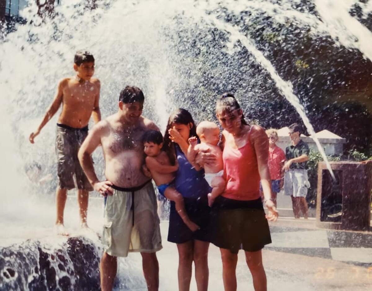 Donny Luciano with (from left) his wife Paulette’s son, Cody, his son Sterling, his daughter Vania, a family friend and her son at the Pineapple Fountain in Charleston.