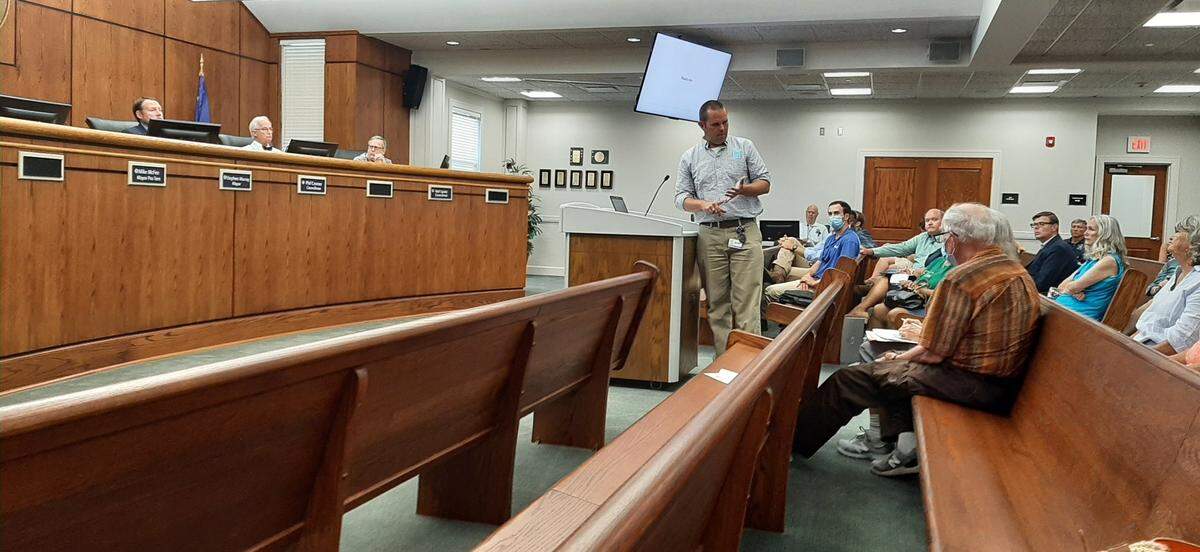 Dominion District Manager Evan Wheeler speaks with residents at a City Council work session last week regarding new power poles that are going up in Beaufort.
