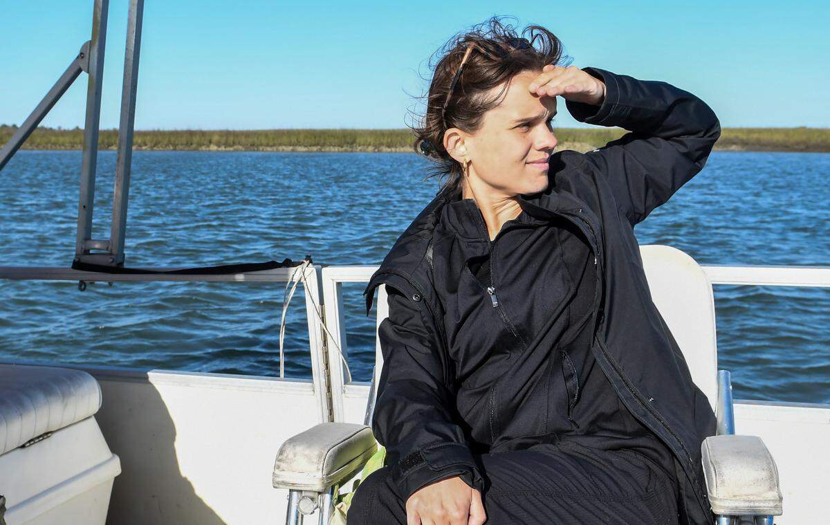 Sarah Haselhorst on a long and cold boat ride out to Pritchards Island, courtesy of Robert and Abby Morris, to witness the erosion taking place on Pritchards Island in April 2022. The Beaufort County barrier island, donated by Philip Rhodes to USCB in 1983, housed the university’s former maritime laboratory that was built in the early 90’s and was being swallowed into the Atlantic Ocean.