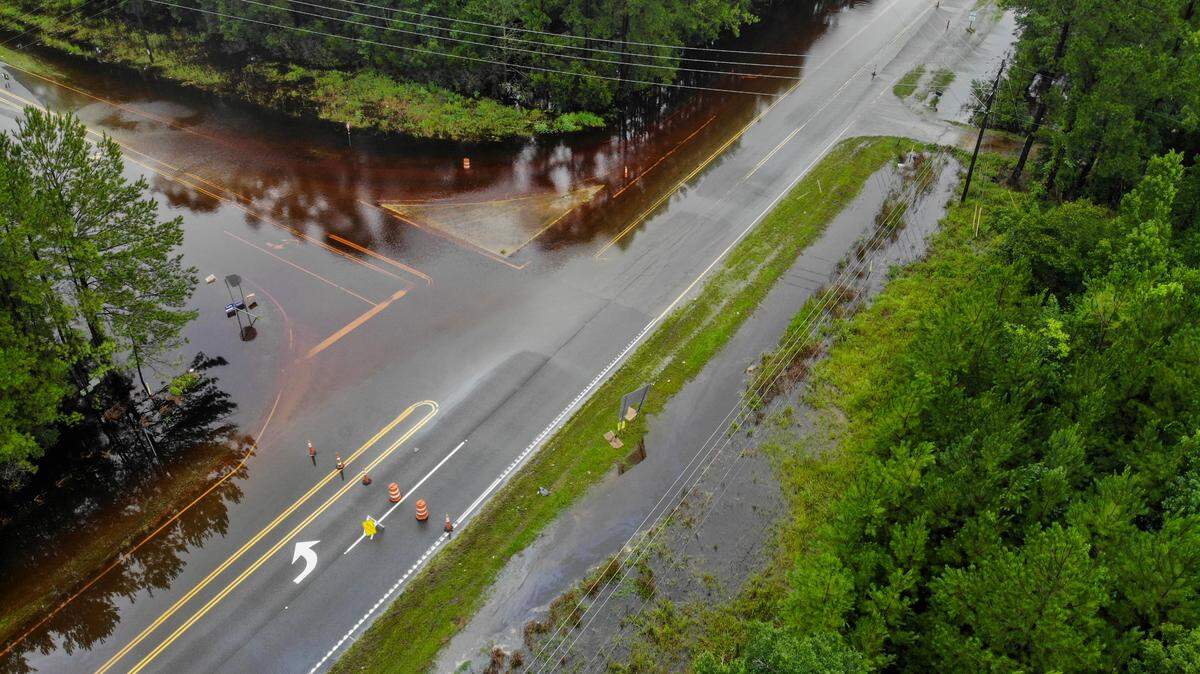 This drone photo shows the intersection where SC 170 and SC 315 meet, flooded and closed indefinitely due to Tropical Storm Debby as photographed on Aug. 7, 2024. A trooper with the South Carolina Highway Patrol was unsure when the waters would recede as intermittent rain continued through the morning hours. S.C. 315 is used by commuters to get to Savannah’s Talmadge Memorial Bridge.