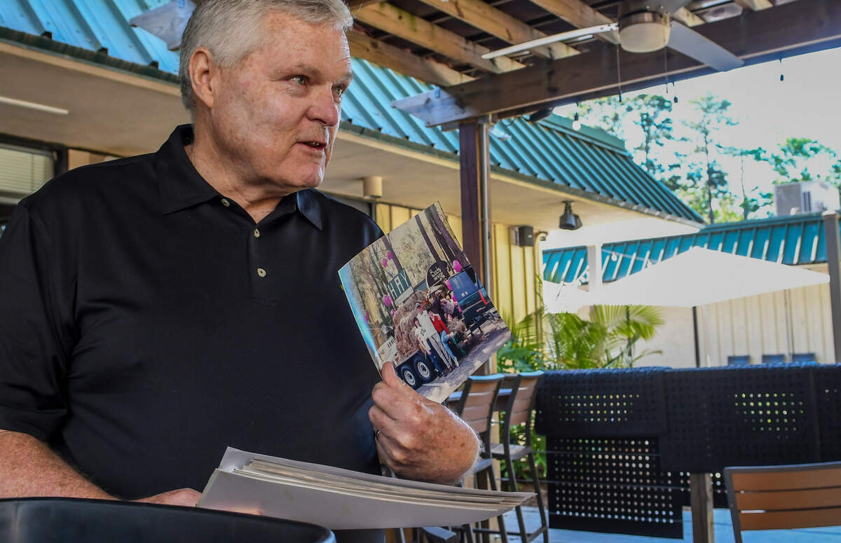 John “Jump” Griffin reminisces on Friday, May 7, 2021, about a photo that once graced the walls of Hilton Head Island’s now-closed Jump & Phil’s Bar and Grill. The former co-owner said that, after they spent too much money on a float for the St. Patrick’s Day Parade, the next year they took a more cost-effective measure, filling a trailer with hay and using signage that read “Hay, Happy St. Patrick’s Day.”