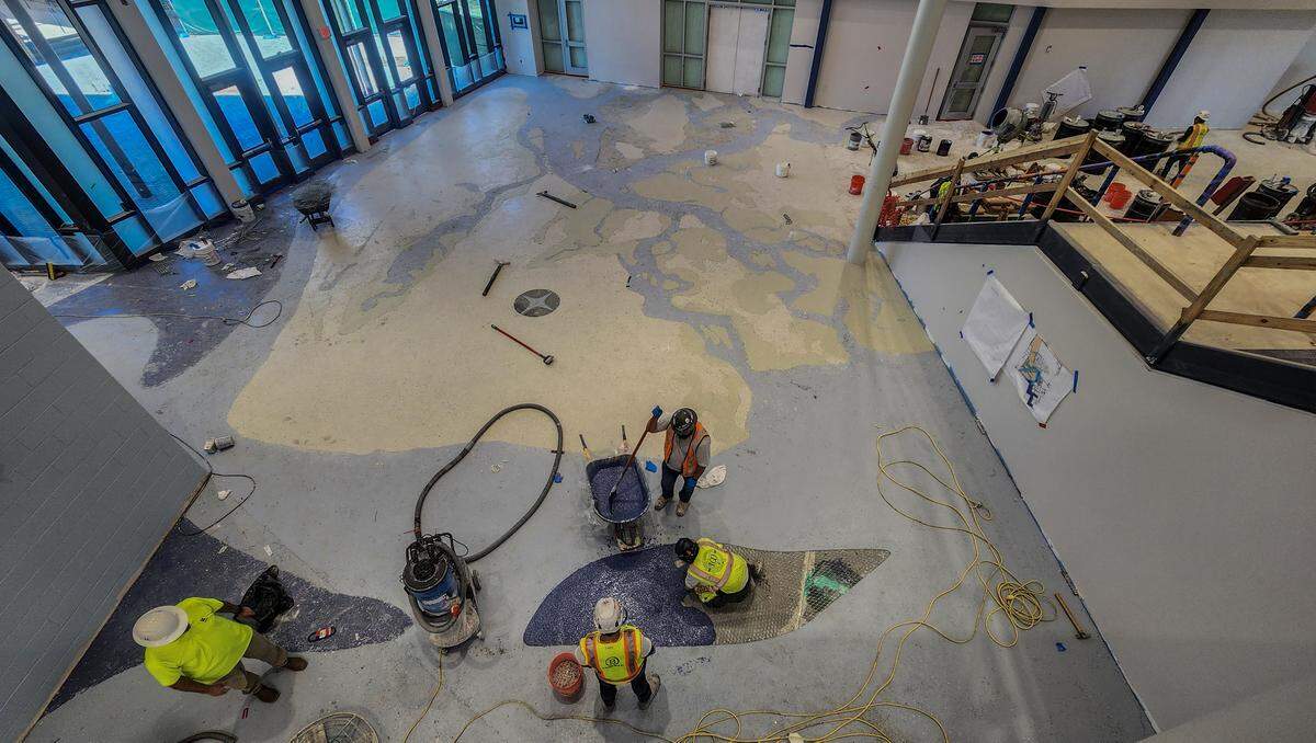 The front lobby of the new Hilton Head Island High School shows workers building a terrazzo floor of Hilton Head and its marshes as photographed on March 26, 2026, on Hilton Head. 