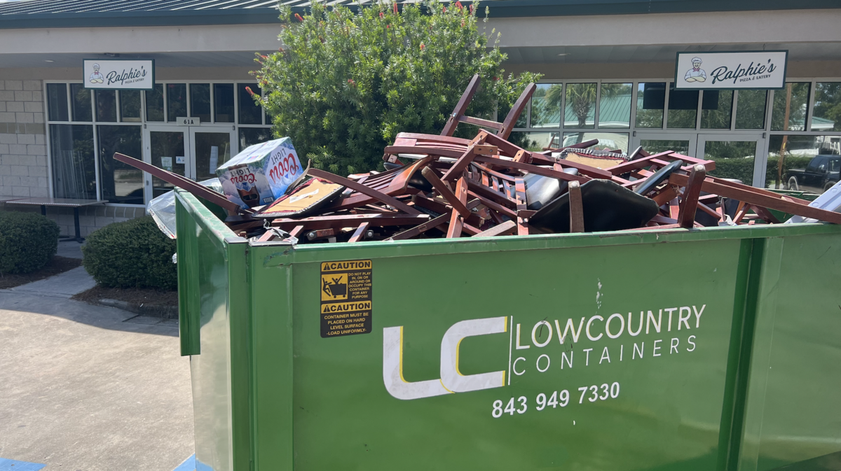 The pizza joint was flooded with over 300 gallons of water after an ice machine sprung a leak in late July. Remnants of the damaged interior filled a dumpster on Thursday afternoon.