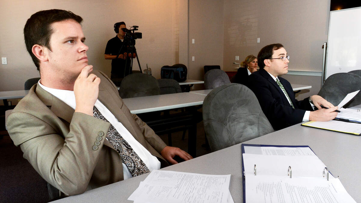Bill Dunker Jr., left, and Brian Hollen -- law students attending the University of South Carolina School of Law are interning with the 14th Judicial Circuit Solicitor's Office -- listen during a training session on their first day with the solicitor's office on Tuesday. Solicitor Duffie Stone created the internship program to give law students a chance he said he never had: to get some courtroom experience before graduation.