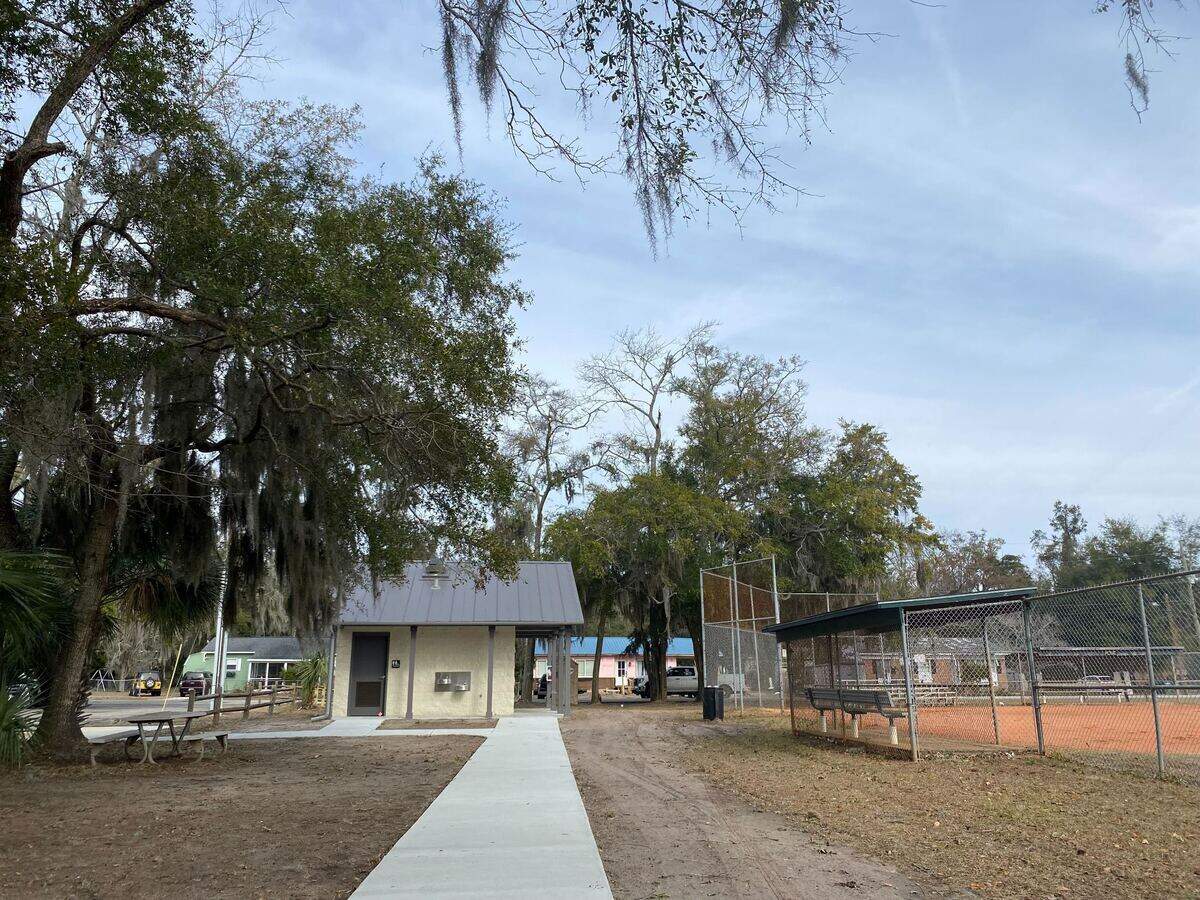 Photo shows the recently installed sidewalk connecting the playground to the bathrooms.