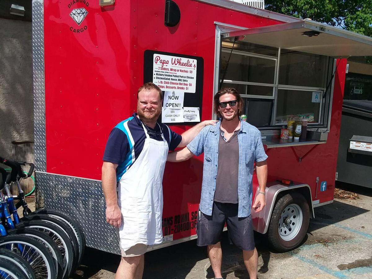 Bryan Bobinchuck and Tim Moore stand outside the Papa Wheelie’s food truck, which is parked on 144 Arrow Road on Hilton Head Island. The truck serves barbecue, hot dogs and nachos.