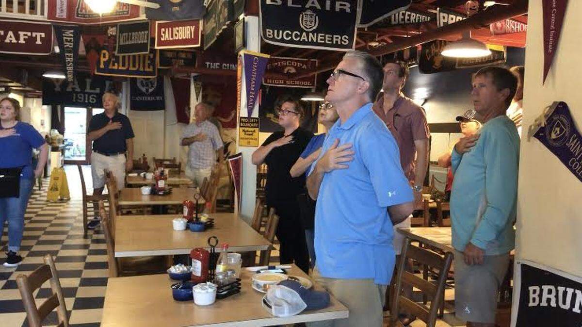 Both locals and visitors stood Wednesday morning at Beaufort’s Blackstone’s Cafe to recite the pledge of allegiance. The pledge is recited daily at 8 a.m. at the restaurant.