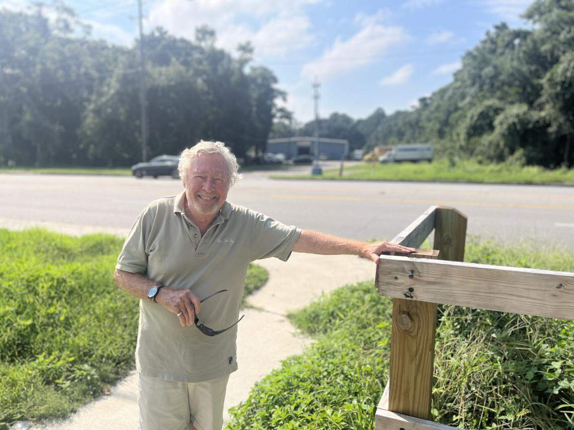 Dean Moss, the founder and executive director of the Friends of the Spanish Moss Trail, stands on the trail where it intersects with Ribaut Road in Port Royal. Signal lights and a pedestrian crosswalk will be installed at this location so the trail can be extended across highly-trafficked Ribaut Road and into the town of Port Royal. Moss had a vision to build the 16-mile trail back when he was still the general manager of the Beaufort Jasper Water and Sewer Authority.