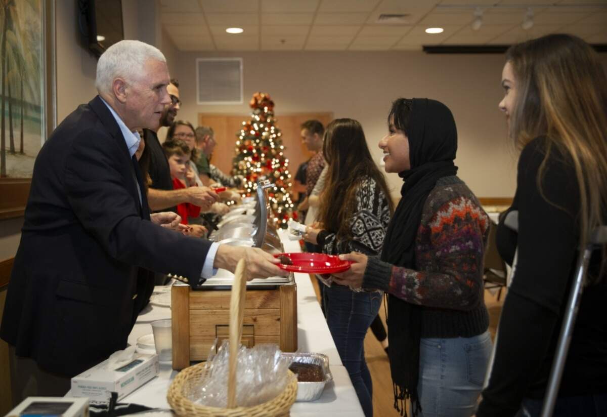 Vice President Mike Pence and Second Lady Karen Pence serve Marines, Sailors and civilians a Thanksgiving meal aboard Marine Corps Air Station Beaufort, Nov. 28. After serving, they gave the service men and women the opportunity to take a photo. (U.S. Marine Corps photo by Sgt. Brittney Vella)
