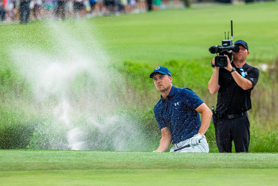 Jordan Spieth hits out of the bunker on the playoff hole Sunday at the RBC Heritage. His ball landed inches from the hole allowing him to put for par and win the tournament.