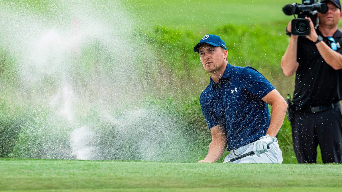Jordan Spieth hits out of the bunker on the playoff hole Sunday at the RBC Heritage. His ball landed inches from the hole allowing him to put for par and win the tournament.