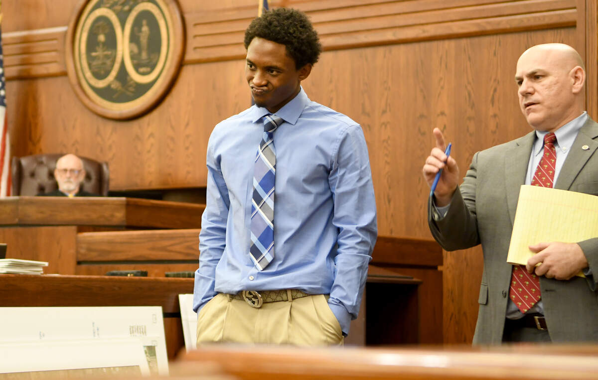 Jestin Morrow, left, takes a moment to think after watching a video of a fight between Dominique Williams and John Ira Duncan III a day before Williams was killed.