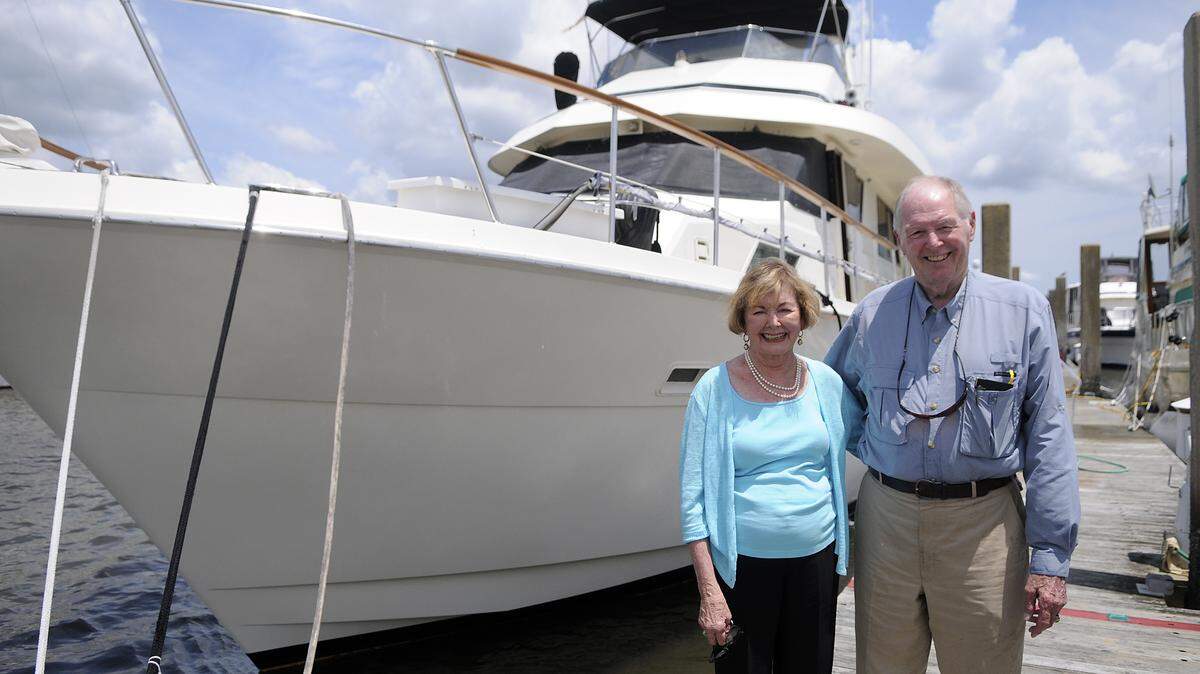 Henry C. Chambers stands with his wife Joye outside of their boat and home, Argonauta, on Thursday afternoon at the Beaufort Downtown Marina in Beaufort.