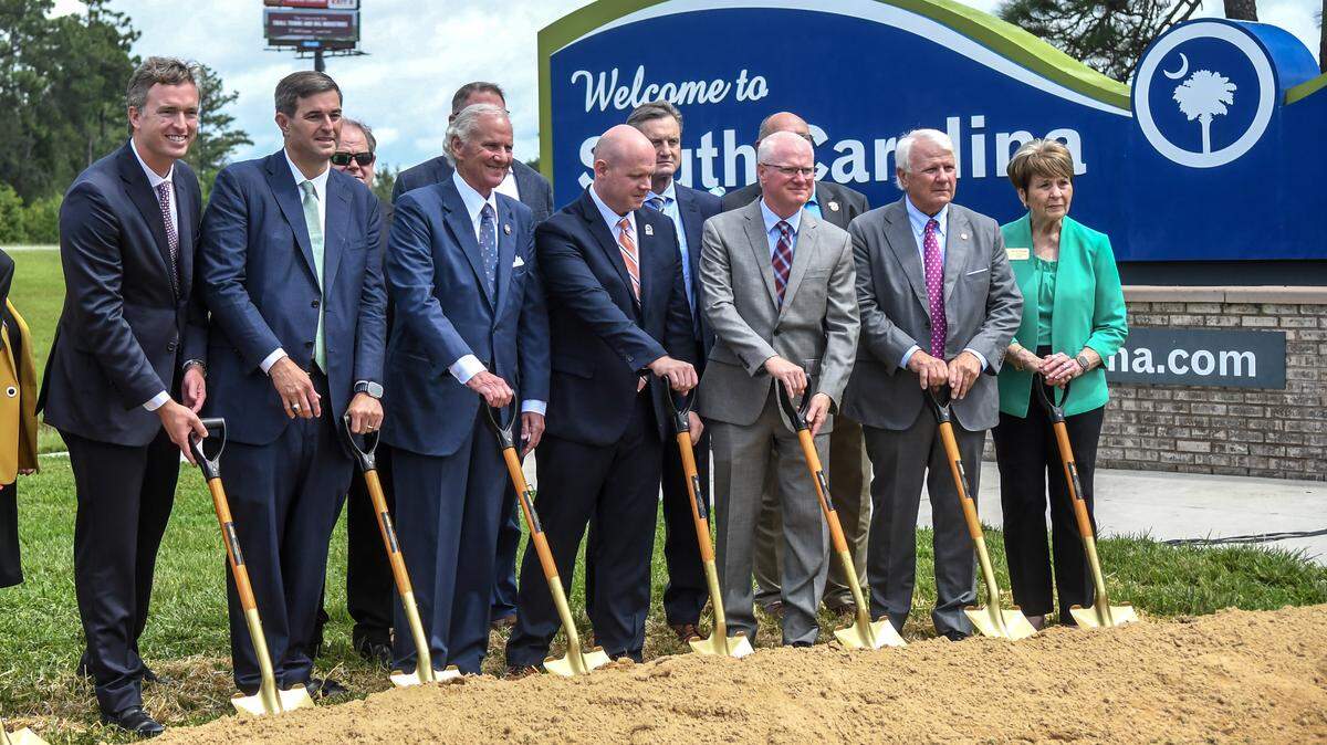 Considered to be a collaborative effort between South Carolina and Georgia, officials stand with S.C. Gov Henry McMaster as they prepare for the ceremonial ground breaking for what has been described as the S.C. Department of Transportation’s largest ever contract. Pictured front row, from left are: Thomas L. Rhodes, III, S.C. Department of Transportation commissioner; G. Murrell Smith, Jr., speaker of the S.C. House of Representatives; S.C. Gov. Henry McMaster; Justin Powell, SCDOT secretary of transportation; Russell McMurry, Ga. Department of Transportation commissioner; Jon Burns, speaker of the Ga. House of Representatives and Ann Purcell, chair of the Ga. State Transportation Board.