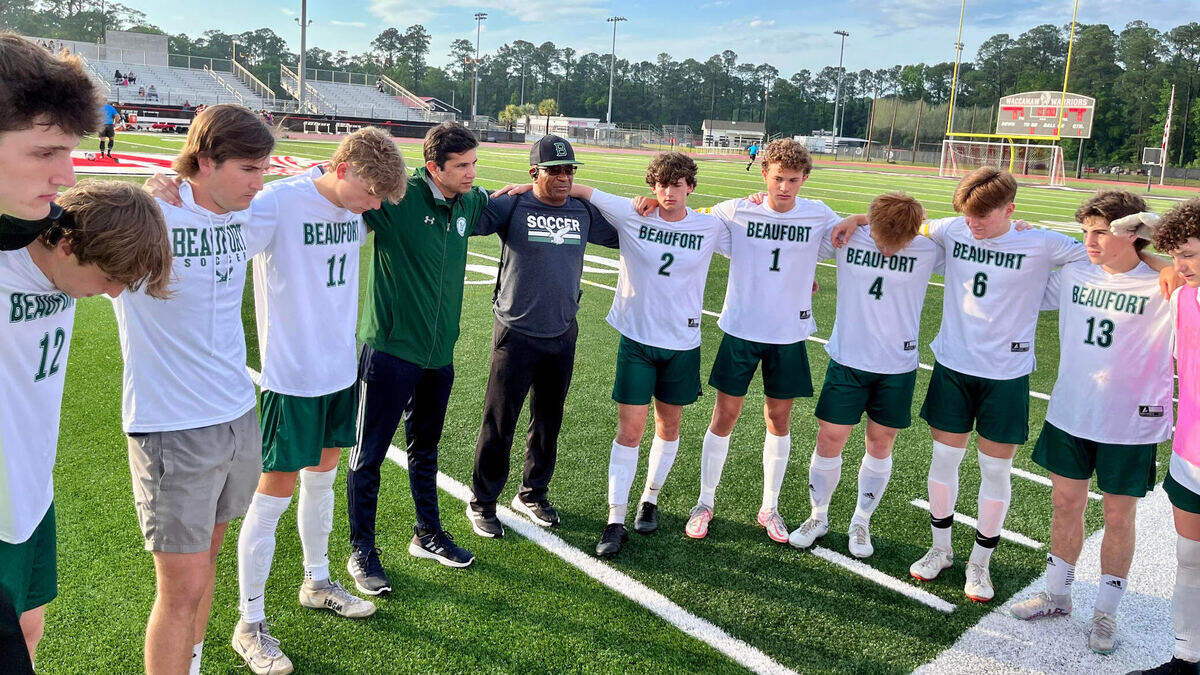 Beaufort players and coaches gather together before the Class 3A Lower State boys soccer match on Monday, May 8, 2023.