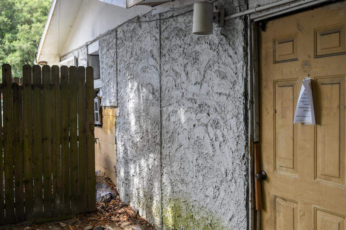 The original, concrete-block building opened by Alexander Patterson in 1954 can be seen in the failing stucco beyond the wooden fence as photographed on July 16, 2024 on Hilton Head Island.
