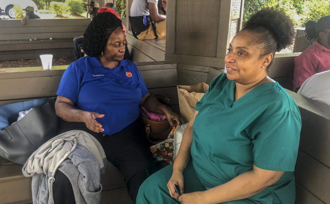 Ernestine Fryer (left) and Audrey Stephens wait at the Hilton Head Island McDonald’s for the Route 320 bus to Colleton County on Aug. 6, 2019. The bus route is losing funding because the Colleton County Council chose not to allocate over $27,000 to the program this year.
