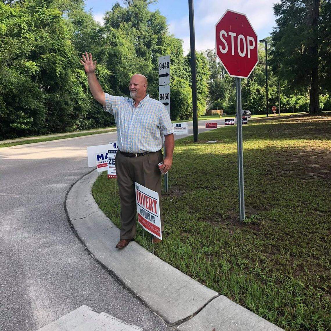 Beaufort County Council member Mike Covert waves to constituents during Tuesday’s primary election day.