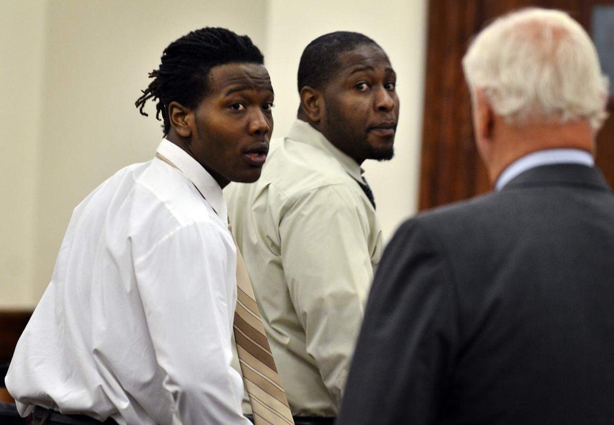 In this file photo, Aaron Scott Young Jr., 20; left, and his father, Aaron Scott Young Sr., 37, leave the courtroom at the Beaufort County Courthouse.