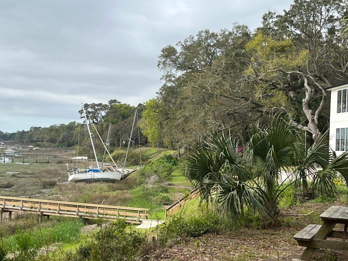 The backyard views of the Beaufort River from homes along Bay Street have included beached boats since September when Tropical Storm Helene caused several boats to break free from the city marina.