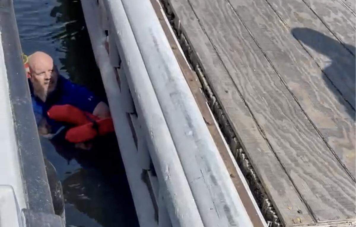 This screen grab taken from a video shows the passenger who fell into the water between the ferry dock and the boat on Thursday, March 14, 2024 on Daufuskie Island.