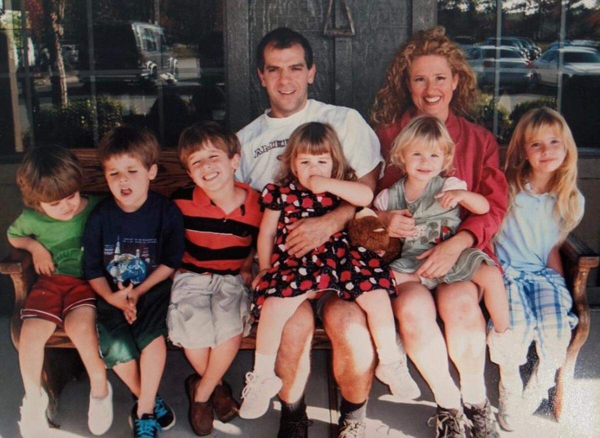 This photo, taken in 2010, captures parents Philip and Kimberly Rios holding onto their six children, Thaddaeus, Nathanael, August, Elizabeth, Charlotte and Adeline.