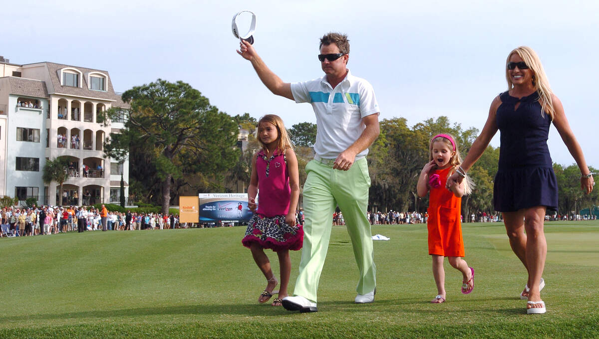 Brian Gay walks off the 18th green with his family, from left to right,  McKinley, Brantley, and wife Kimberly after the final round of the 2009 Verizon Heritage at the Harbour Town Golf Links Sunday afternoon.
