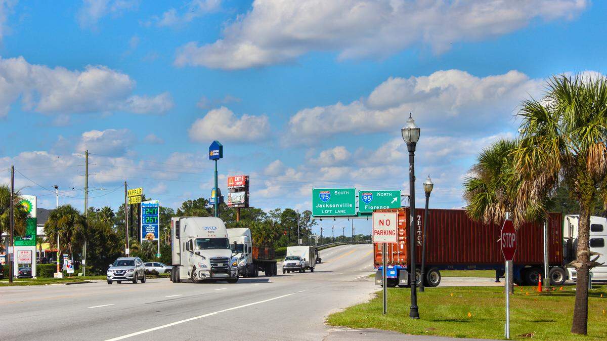 Trucks drive through the intersection of I-95 and Whyte Hardee Boulevard in Hardeeville, South Carolina. Housing is booming in the town
