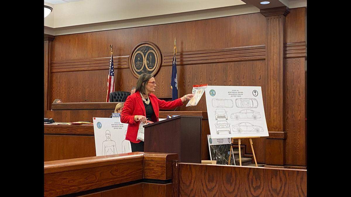 Assistant Solicitor Mary Jones with the 14th Circuit Solicitor’s Office shows jurors bullet casings collected from the scene of the chaotic Circle K shootout on Lady’s Island in June 2019, during the murder trial of Jeffrey Redd on Feb. 17, 2022.