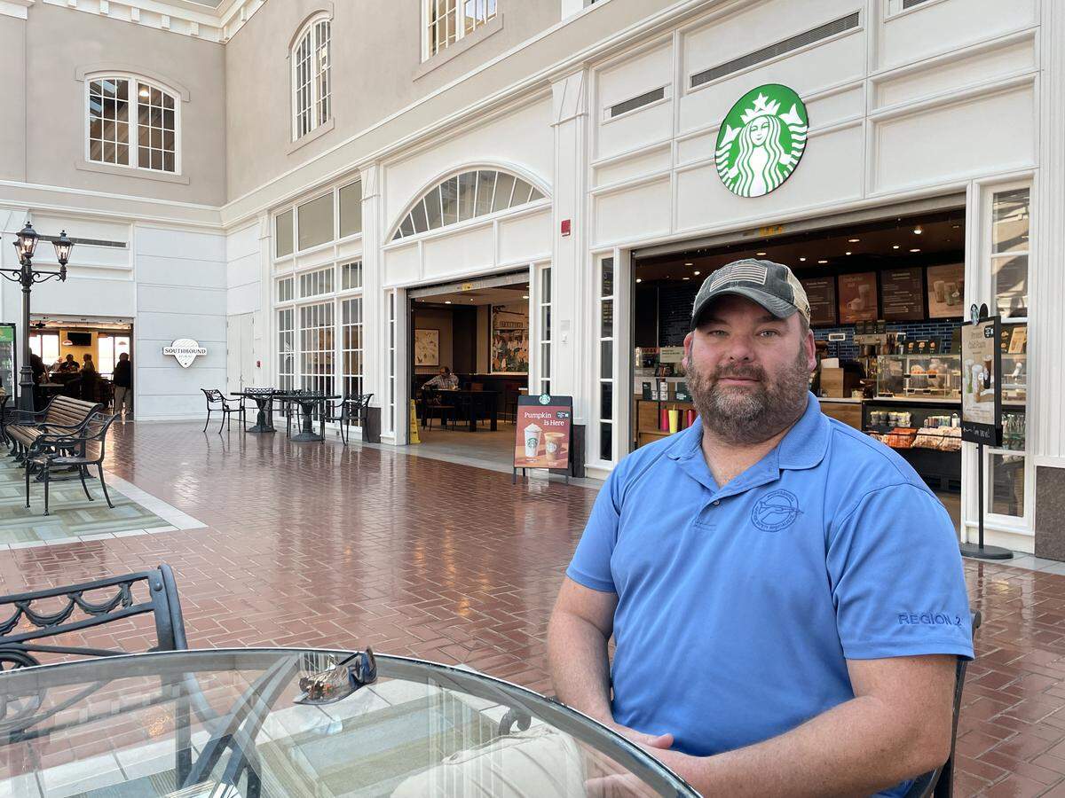 Roy Weaver sits in the atrium at Savannah-Hilton Head International Airport. During the longest government shutdown in history, Weaver and many of his colleagues at the FAA are working without pay.